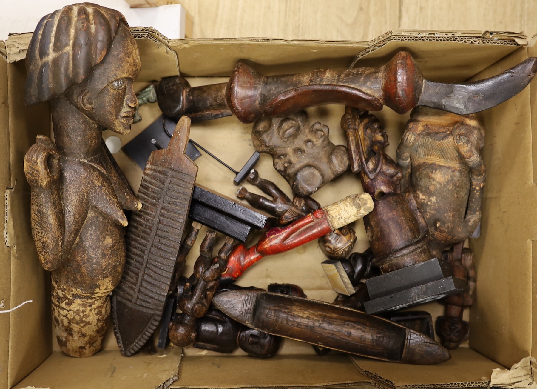 A large quantity of African wood carvings, gourd water carriers, etc.